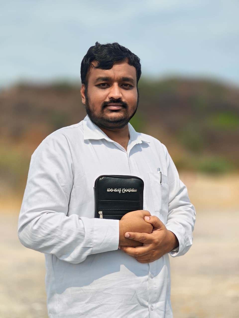 Evangelist portrait holding the Bible.