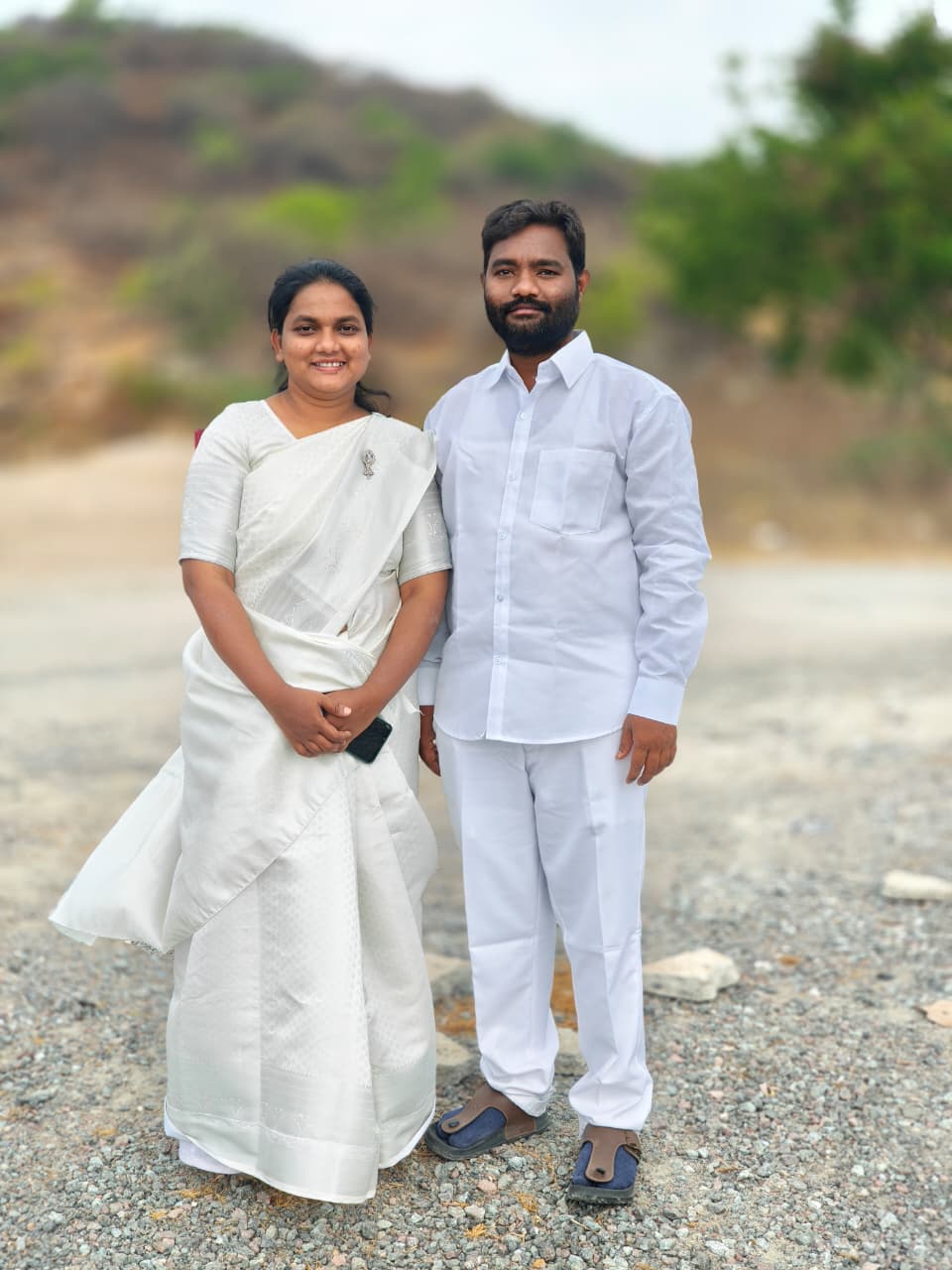Pastor Arun Samuel and Swathi Samuel portrait outdoors.
